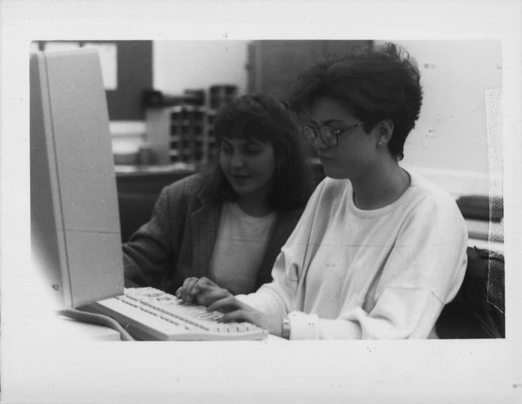 Two female journalism students working at computer | Lehigh Preserve