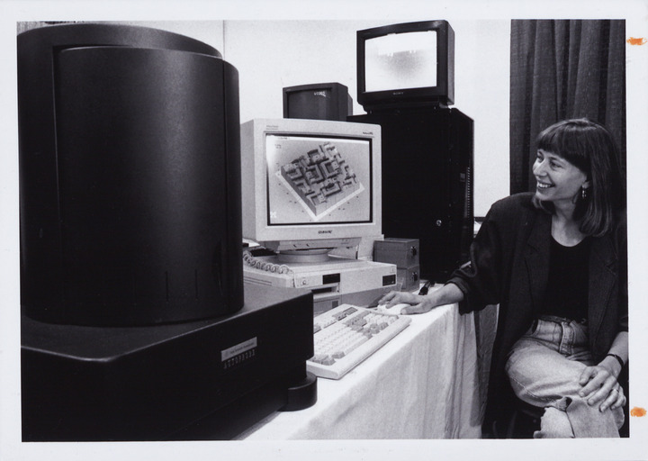 Susan L. Maher deomonstrating microscope | Lehigh Preserve